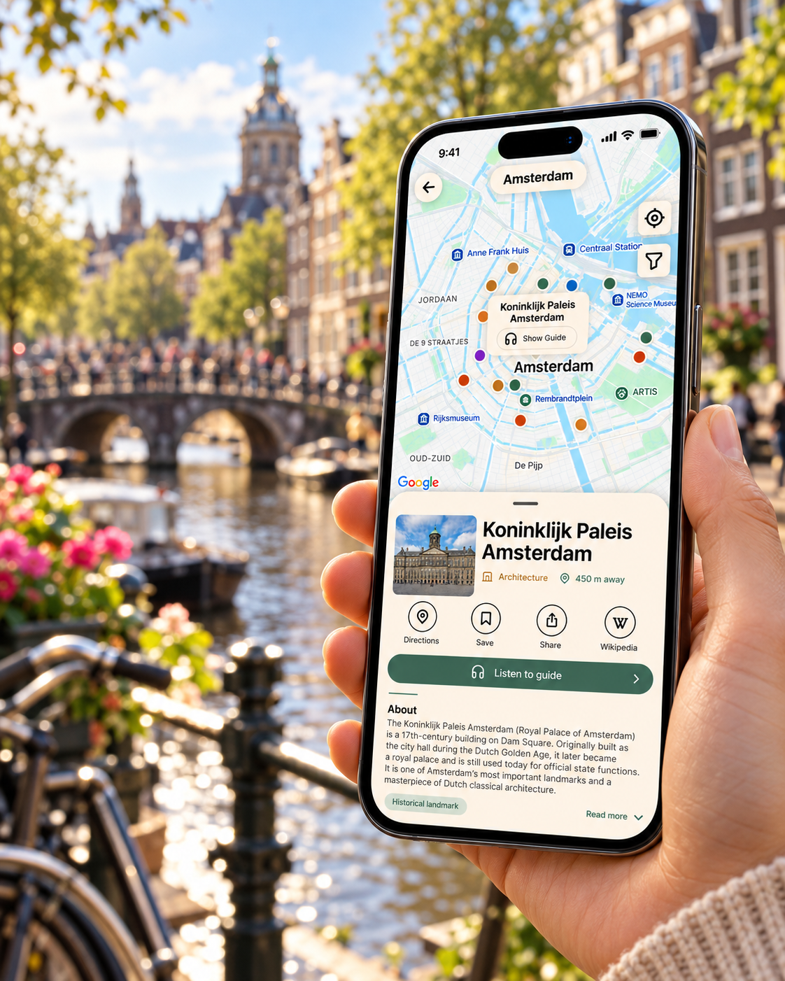 Voyager map and audio guide on a phone beside an Amsterdam canal